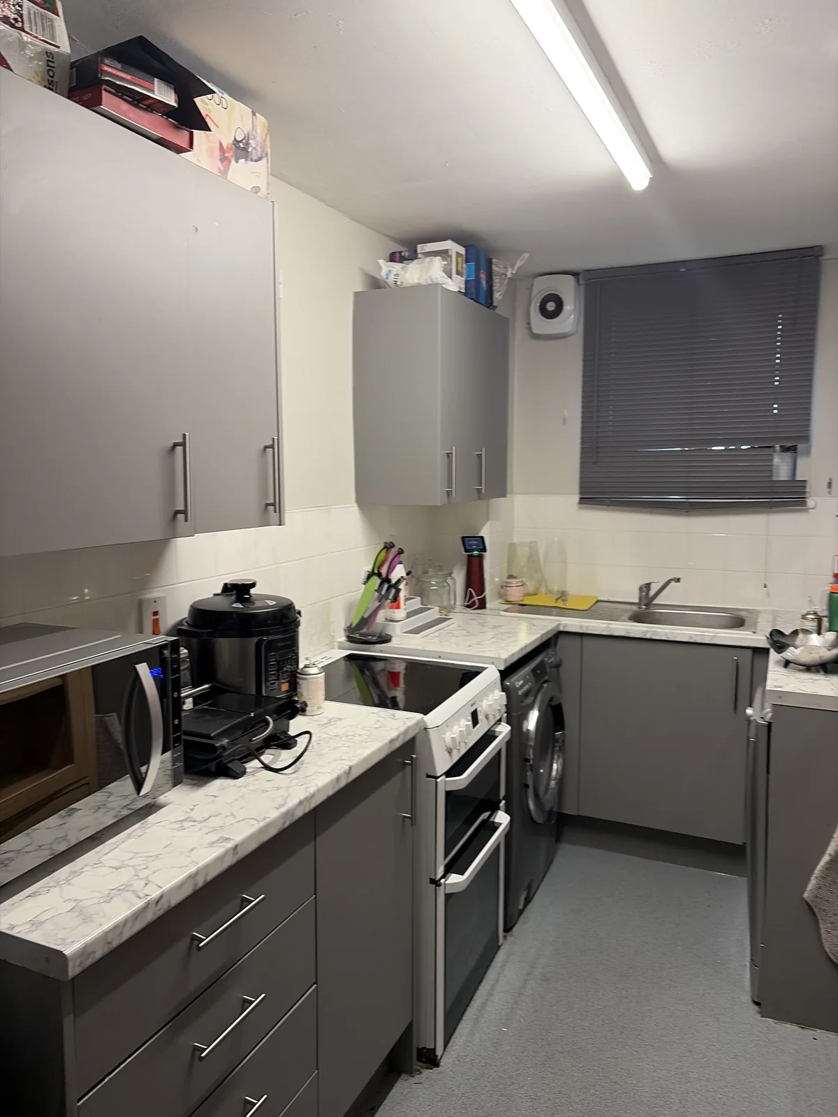 Same grey kitchen after cleaning by HomeGlow Cleaning Services